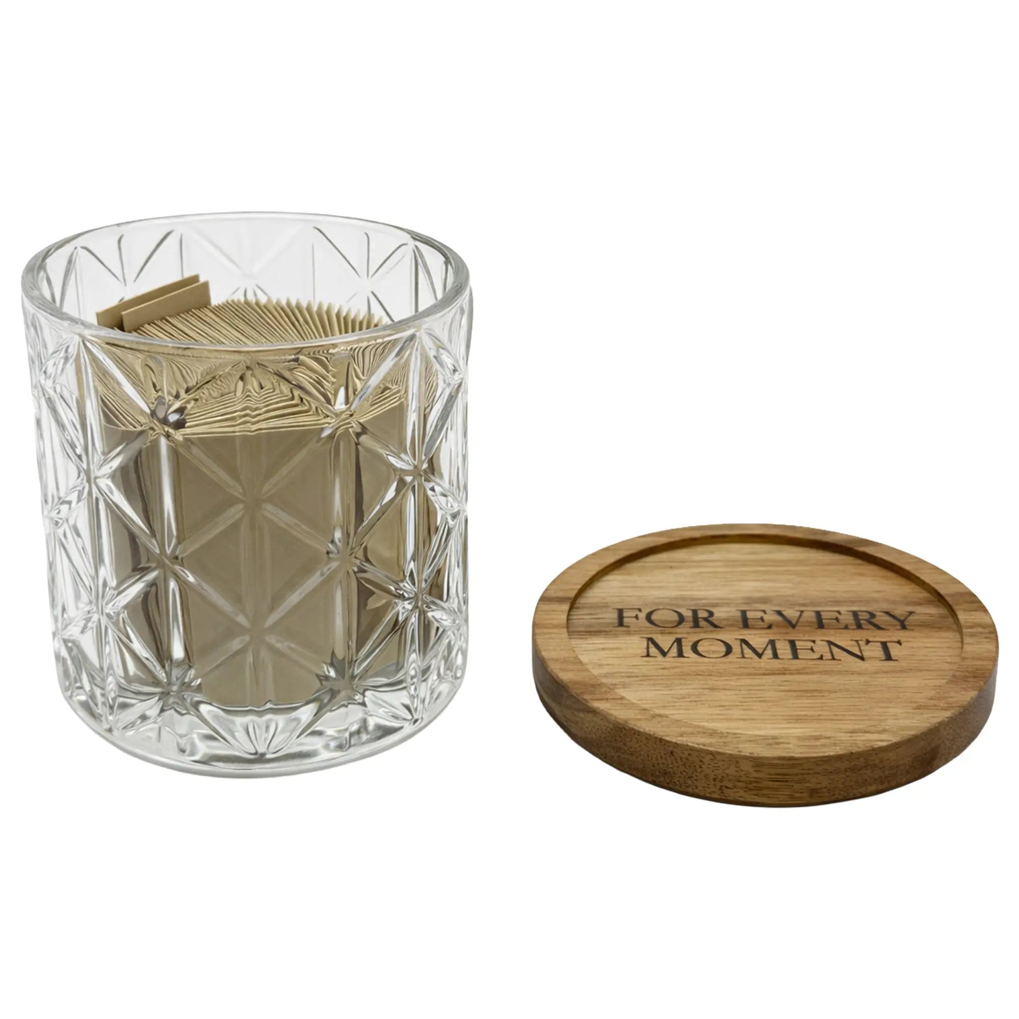 Clear glass container with brown napkins and wooden lid on a white background