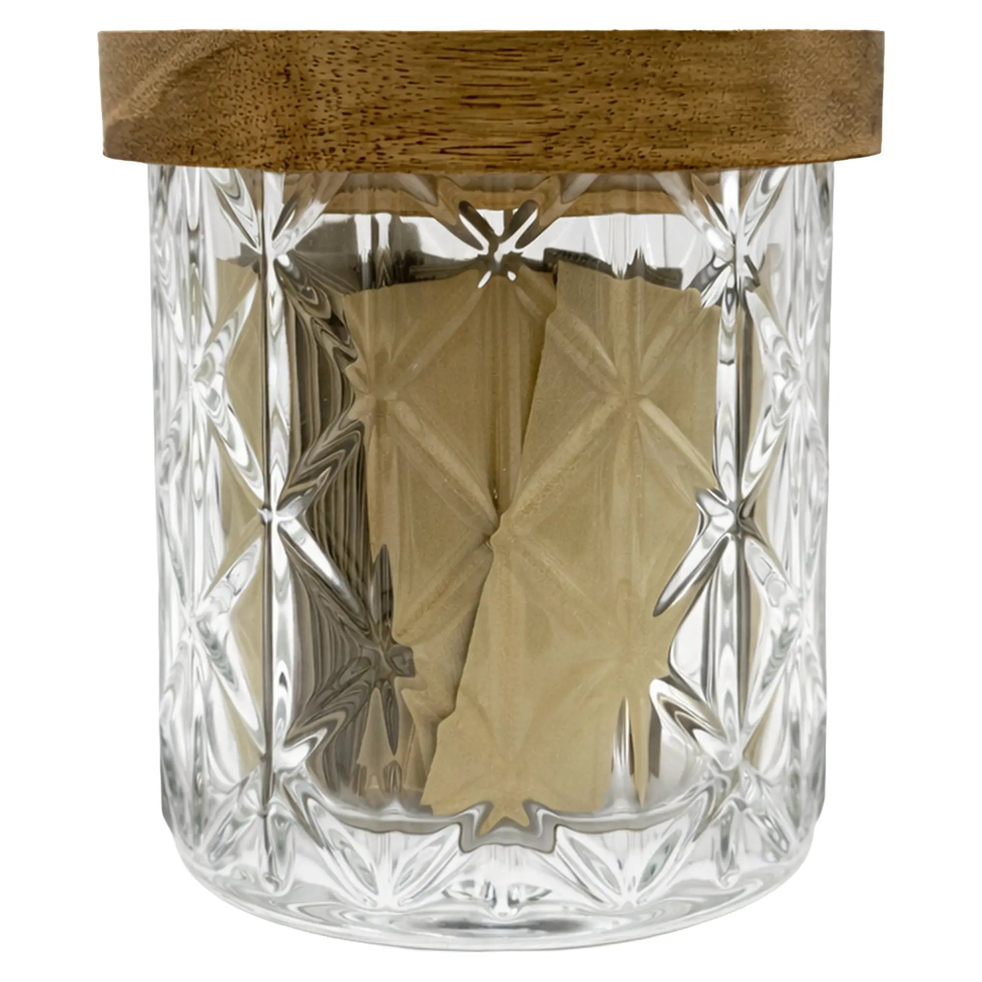 Clear glass jar with wooden lid containing gold packets on a white background