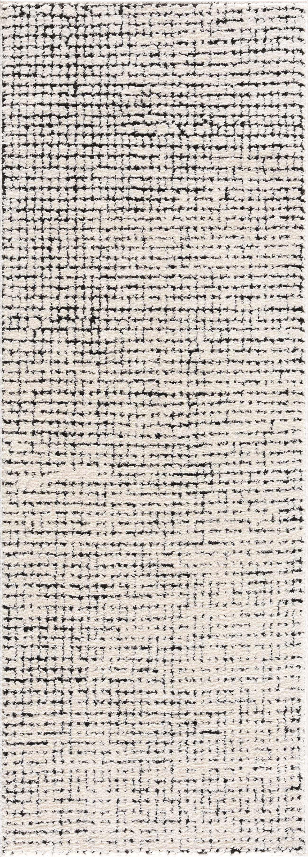 Black and white textured area rug with geometric pattern, cozy farmhouse style home decor