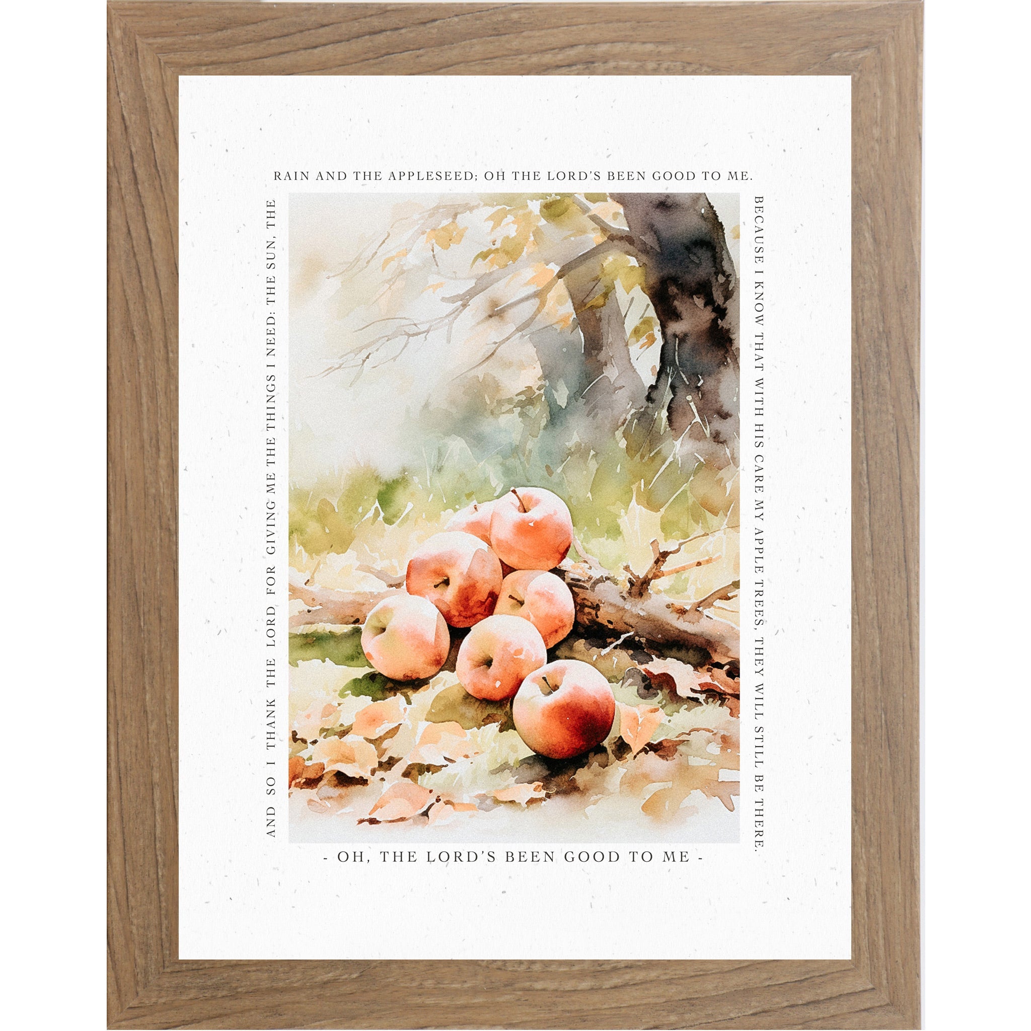 Framed artwork with apples and nature-themed text on a white background