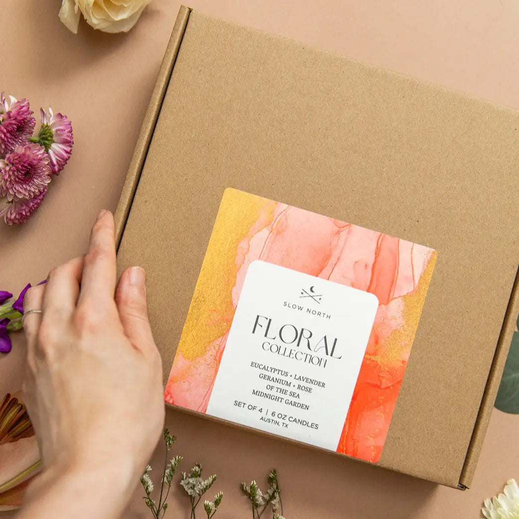 Floral Collection candle set in kraft box with eucalyptus, lavender, geranium, rose scents, surrounded by fresh flowers