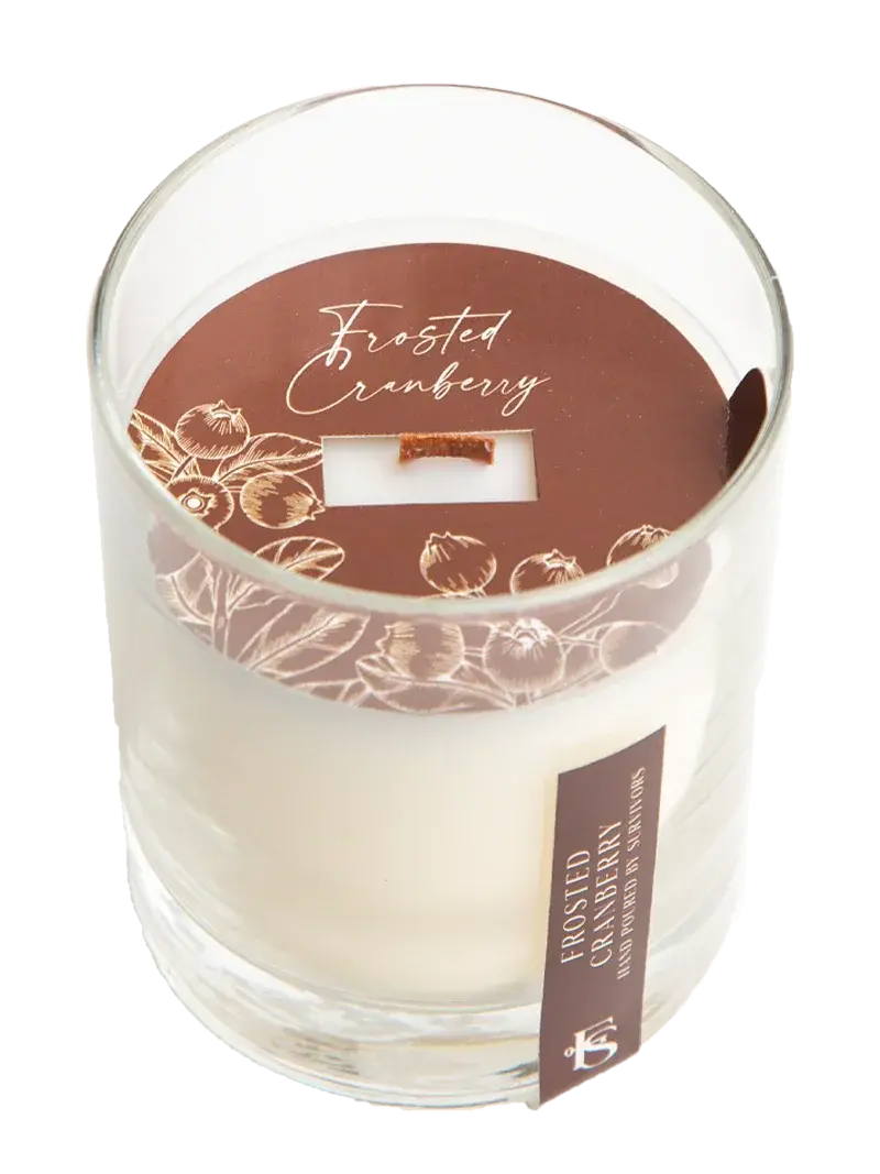 Frosted Cranberry scented candle in clear glass jar with wooden wick, cozy home decor