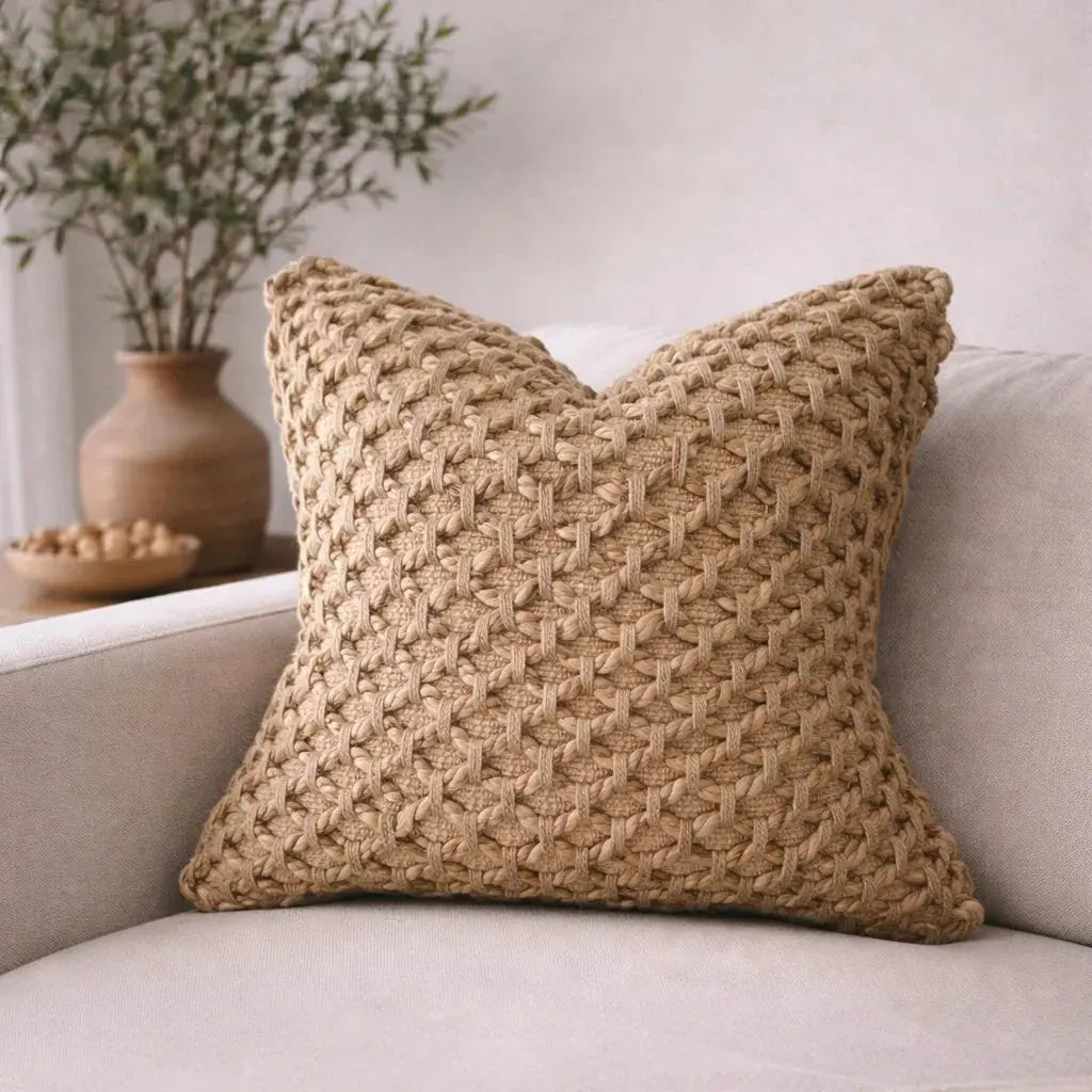 Textured woven throw pillow in neutral tone for cozy farmhouse living room decor