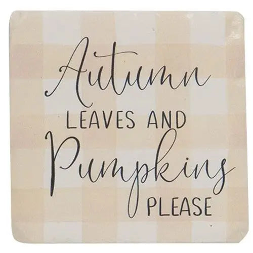 Decorative sign with 'Autumn Leaves and Pumpkins Please' text on a checkered background