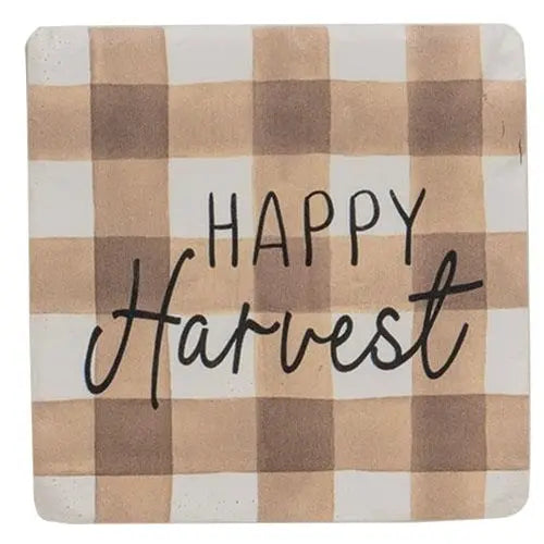 Checkered mat with 'Happy Harvest' text on a plaid pattern