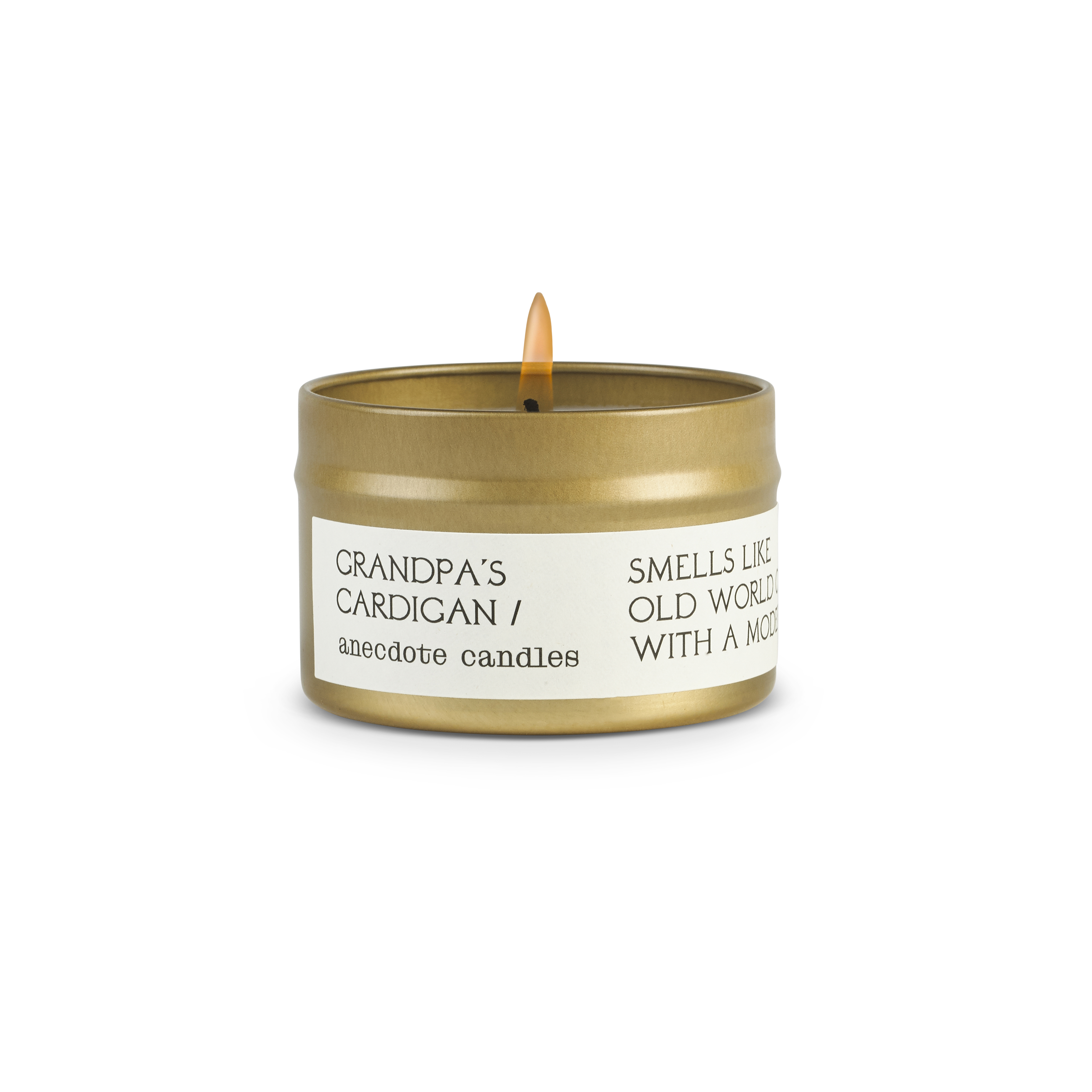 Candle in a tin labeled 'Grandpa's Cardigan' by anecdote candles on a white background