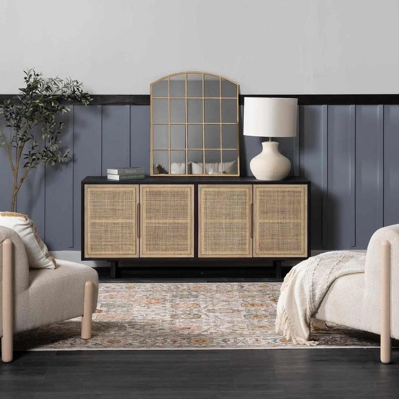 Rattan cabinet with gold mirror and lamp in cozy farmhouse living room decor