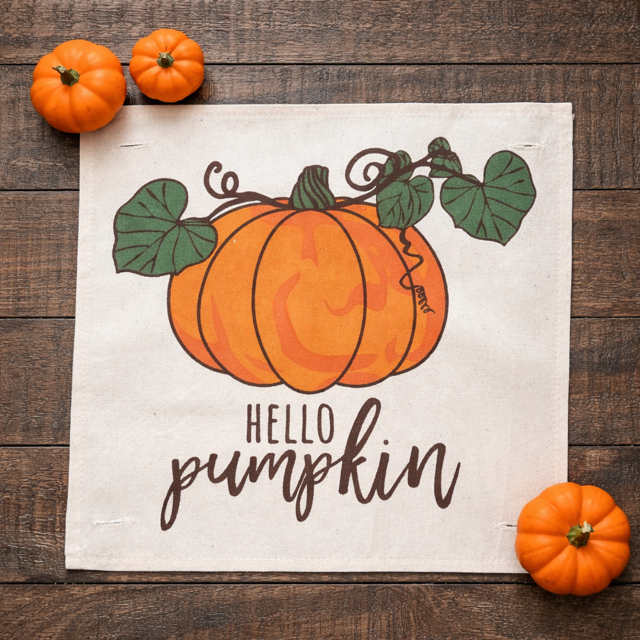 Decorative sign with pumpkins and 'Hello Pumpkin' text on a wooden surface