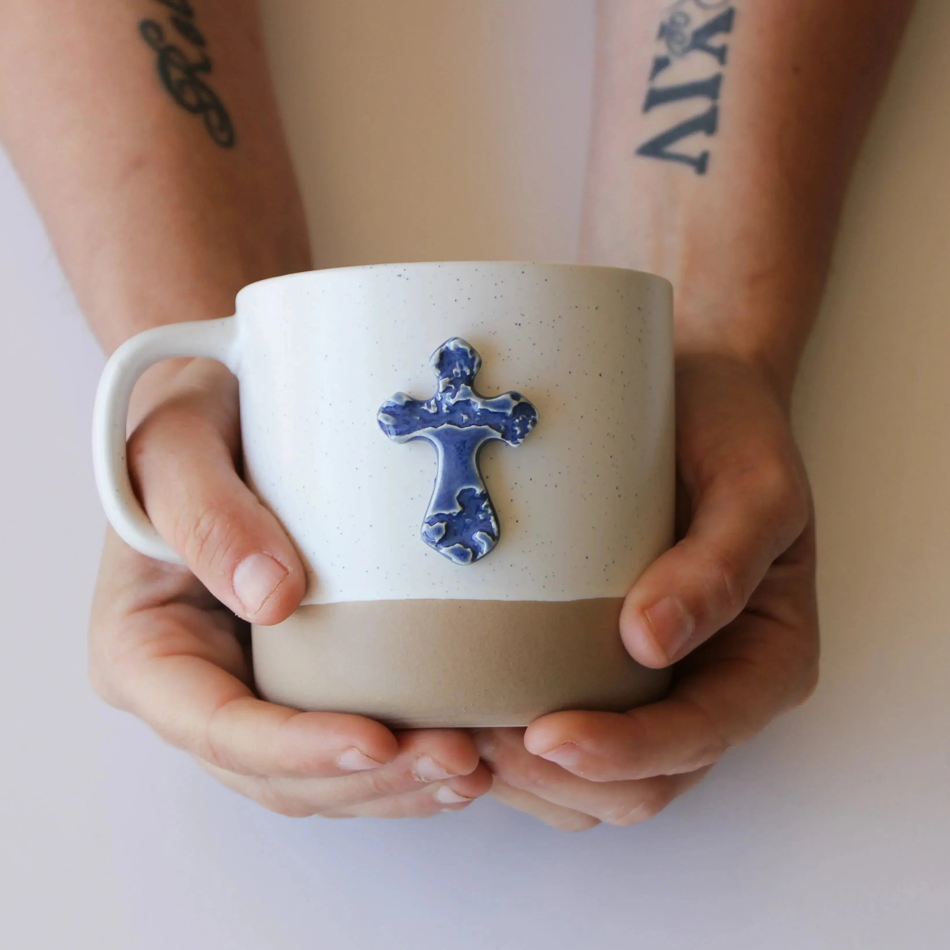 Handmade ceramic mug with blue cross accent, cozy farmhouse decor for coffee lovers