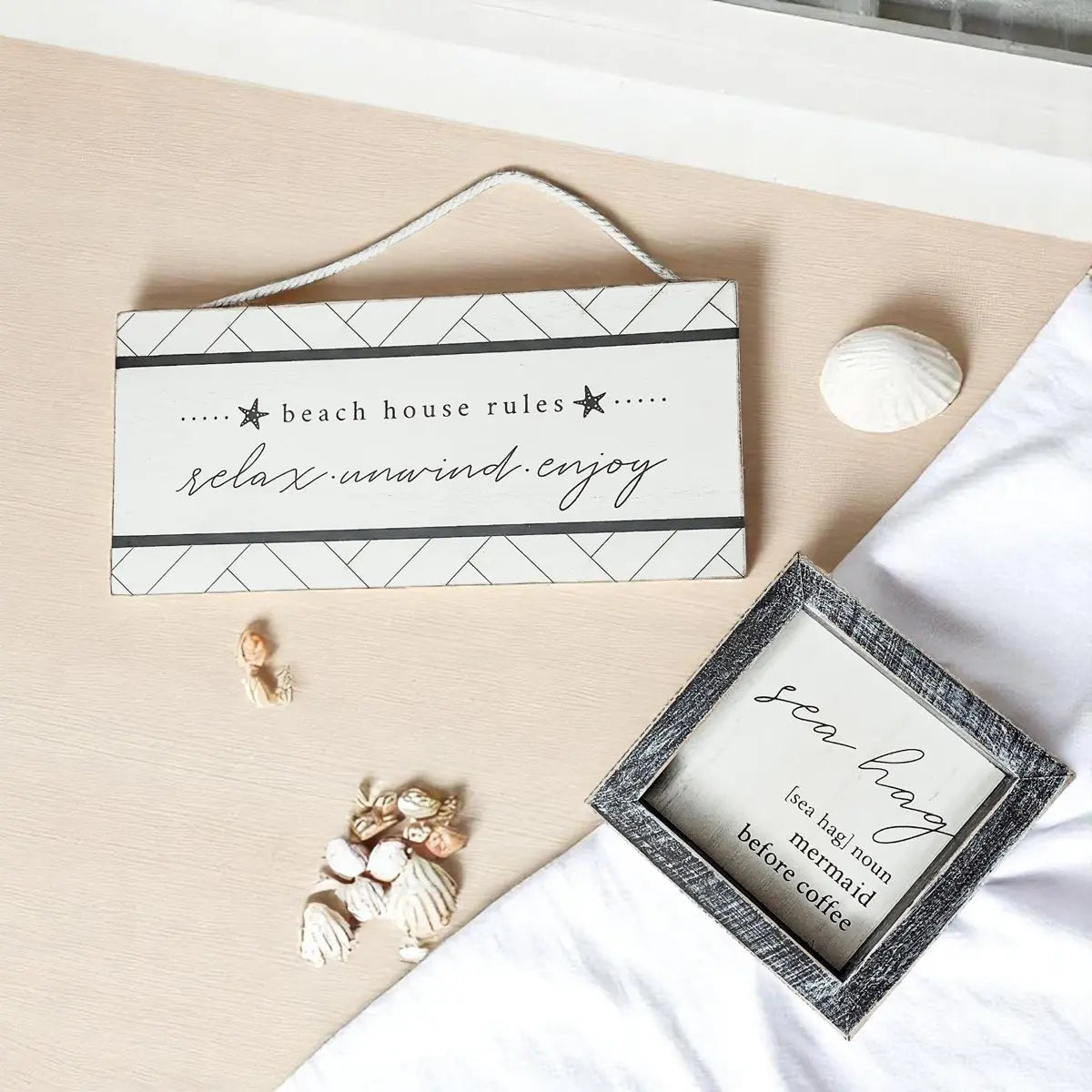 Beach house rules sign with relax unwind enjoy text, coastal decor with seashells and sea hag frame