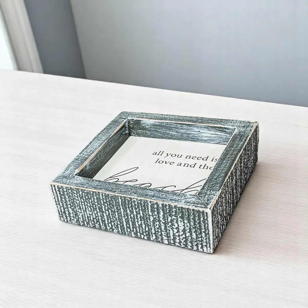 Decorative box with text on a light surface
