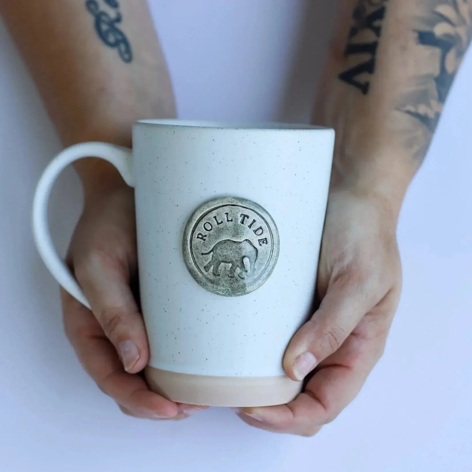 Speckled ceramic mug with 'Roll Tide' elephant emblem, held in hands, farmhouse style home decor