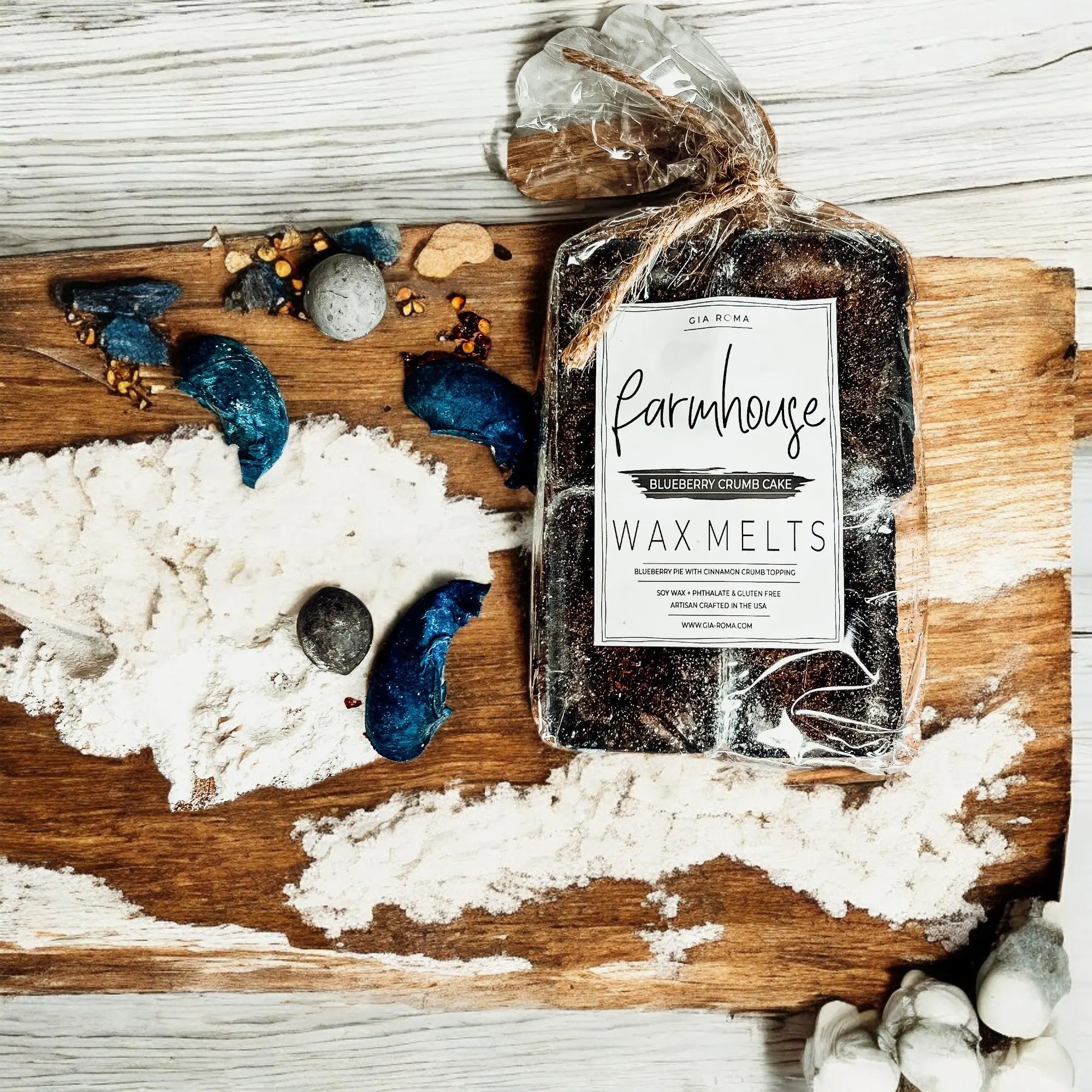 Pack of Farmhouse Wax Melts on a wooden board with decorative elements