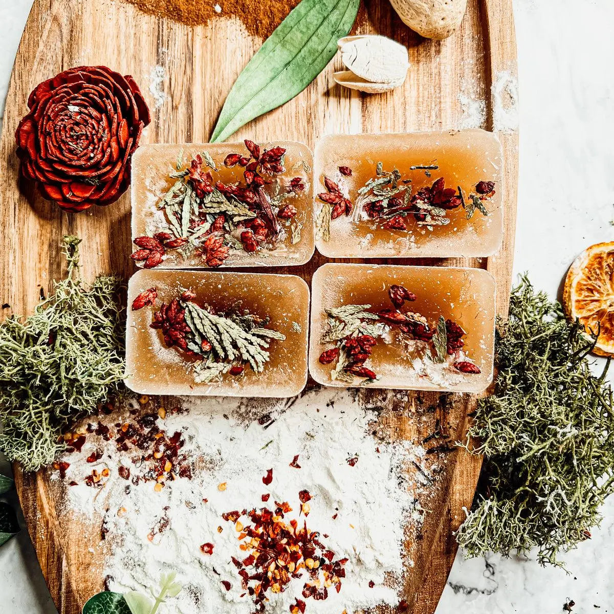 Herbal bath bombs on a wooden board with natural elements
