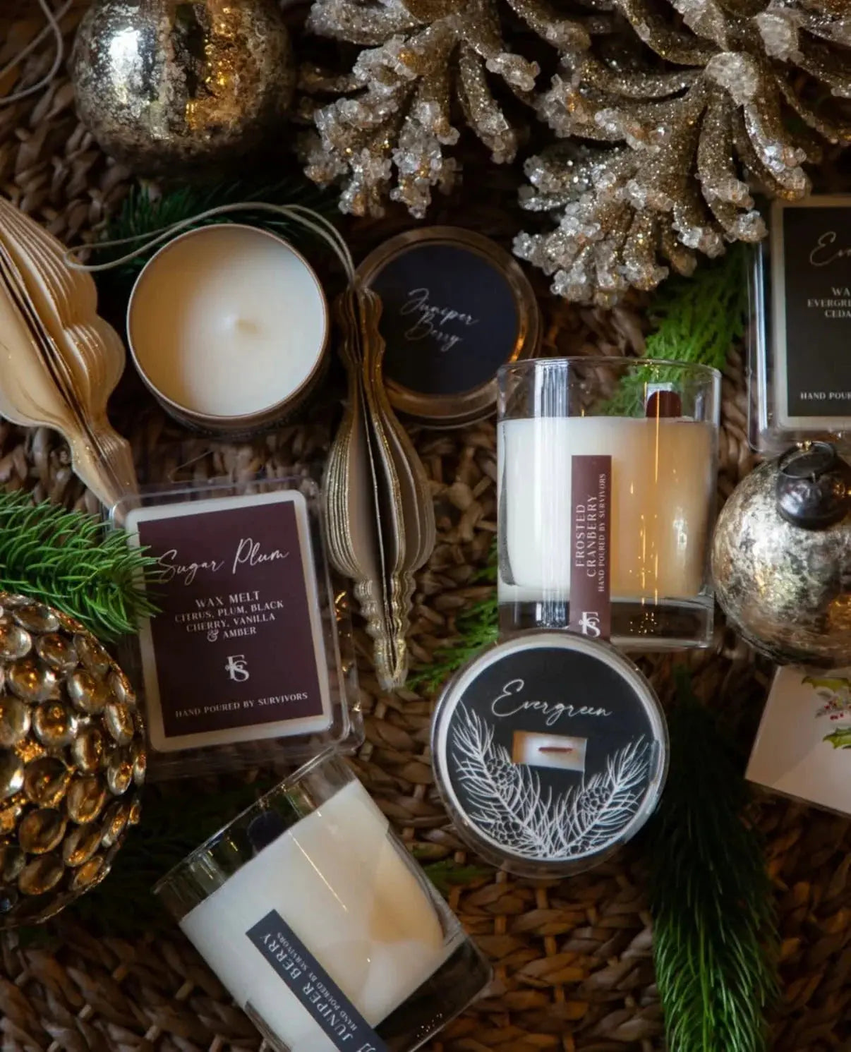 Cozy farmhouse candles with festive ornaments, pine branches, and holiday decor for warm home ambiance