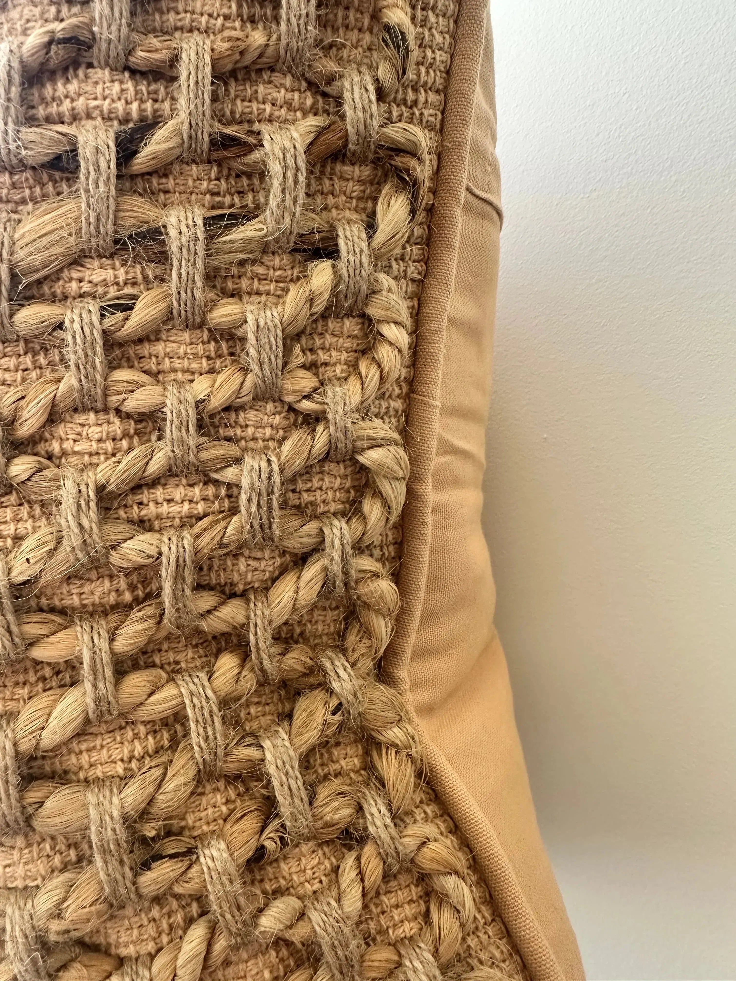 Rustic woven jute pillow with farmhouse charm for cozy home decor
