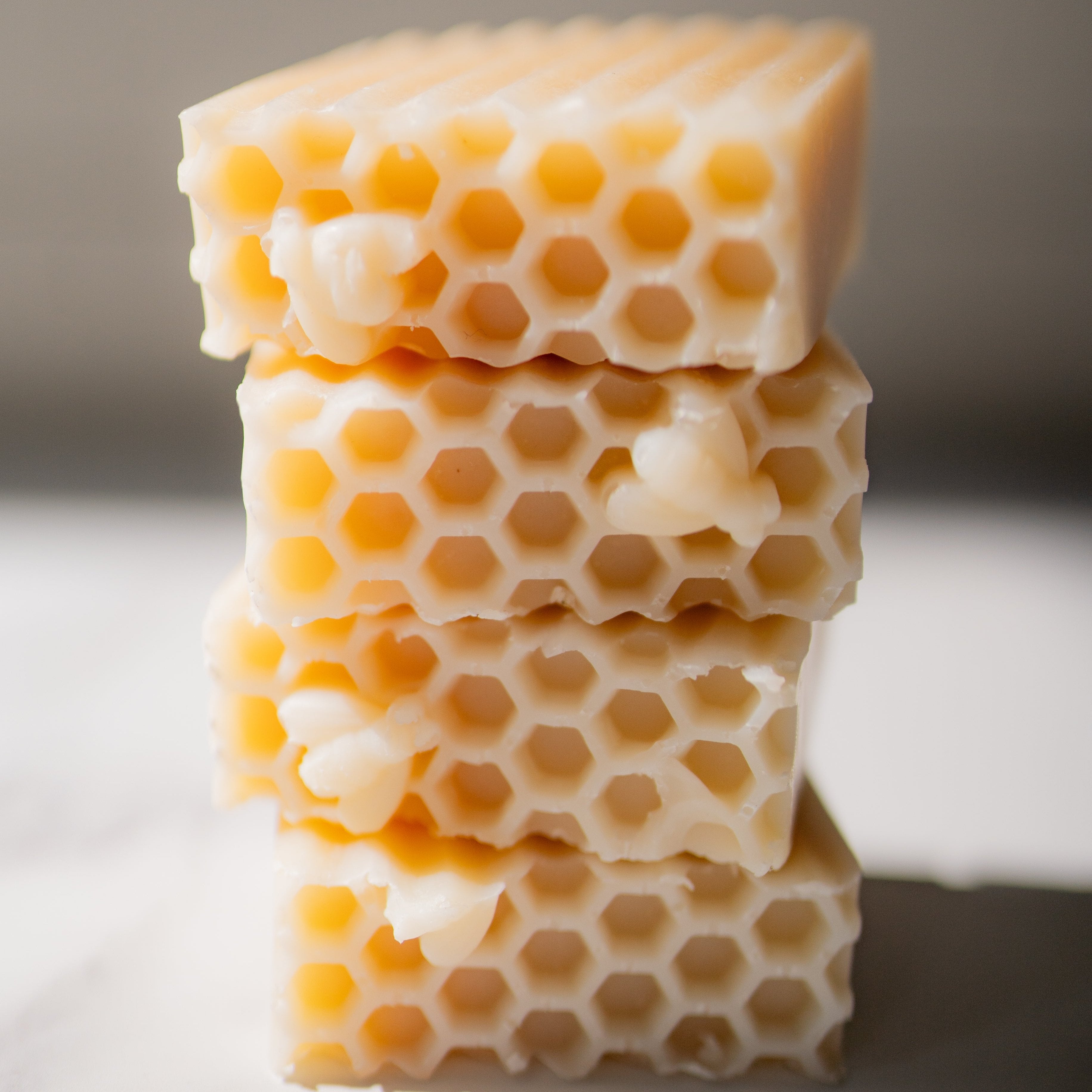 Stack of honeycomb blocks on a neutral background
