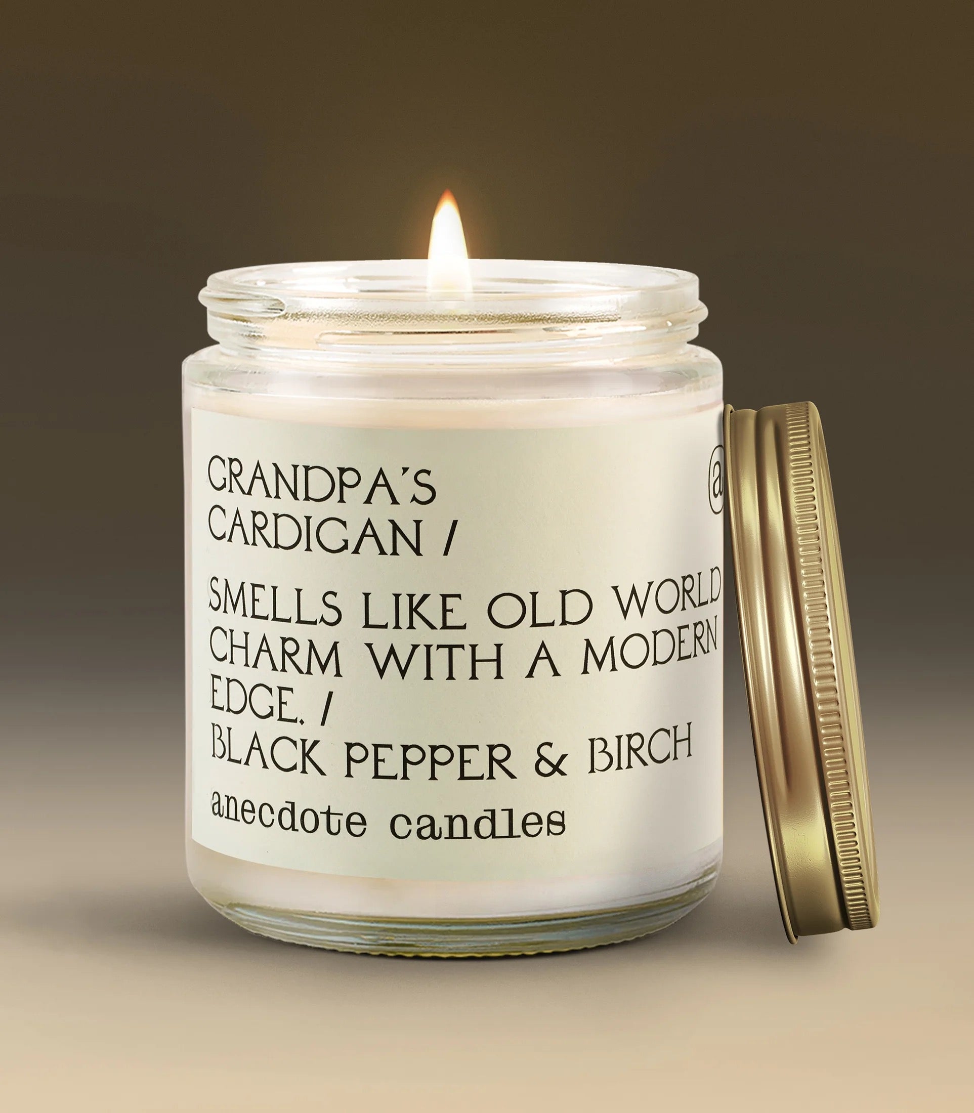 Candle in a glass jar with a label on a gradient background