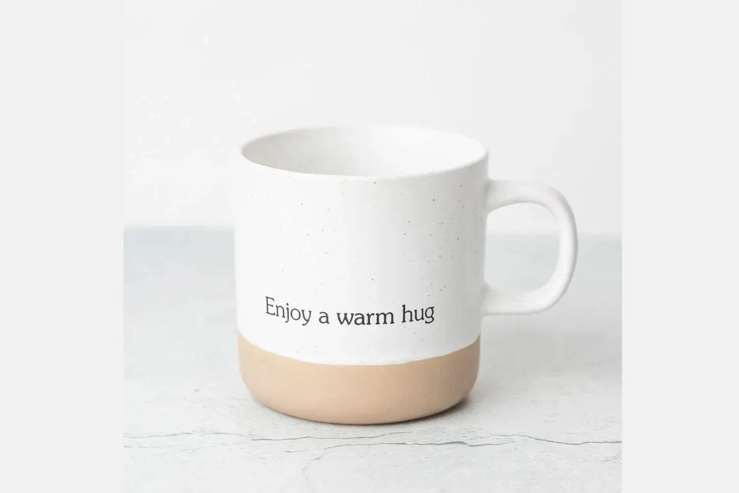 White speckled ceramic mug with 'Enjoy a warm hug' text, farmhouse style cozy home decor