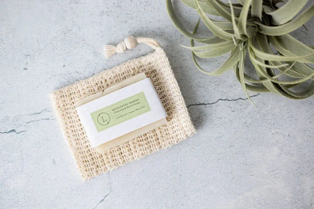 Eucalyptus Orange bar soap in natural soap saver pouch with air plant, farmhouse bath essentials