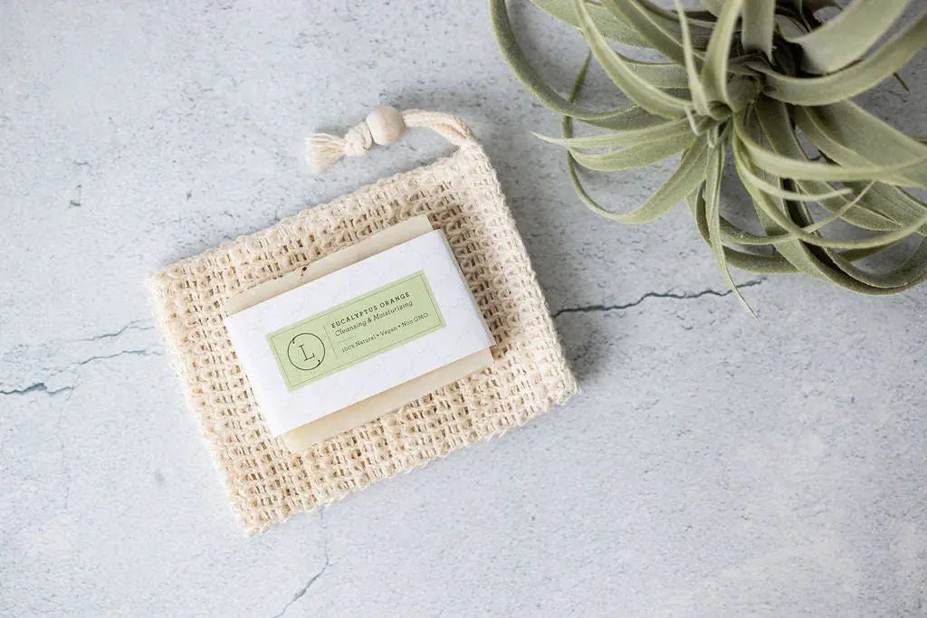 Eucalyptus Orange bar soap on woven soap saver with air plant, cozy farmhouse bath decor