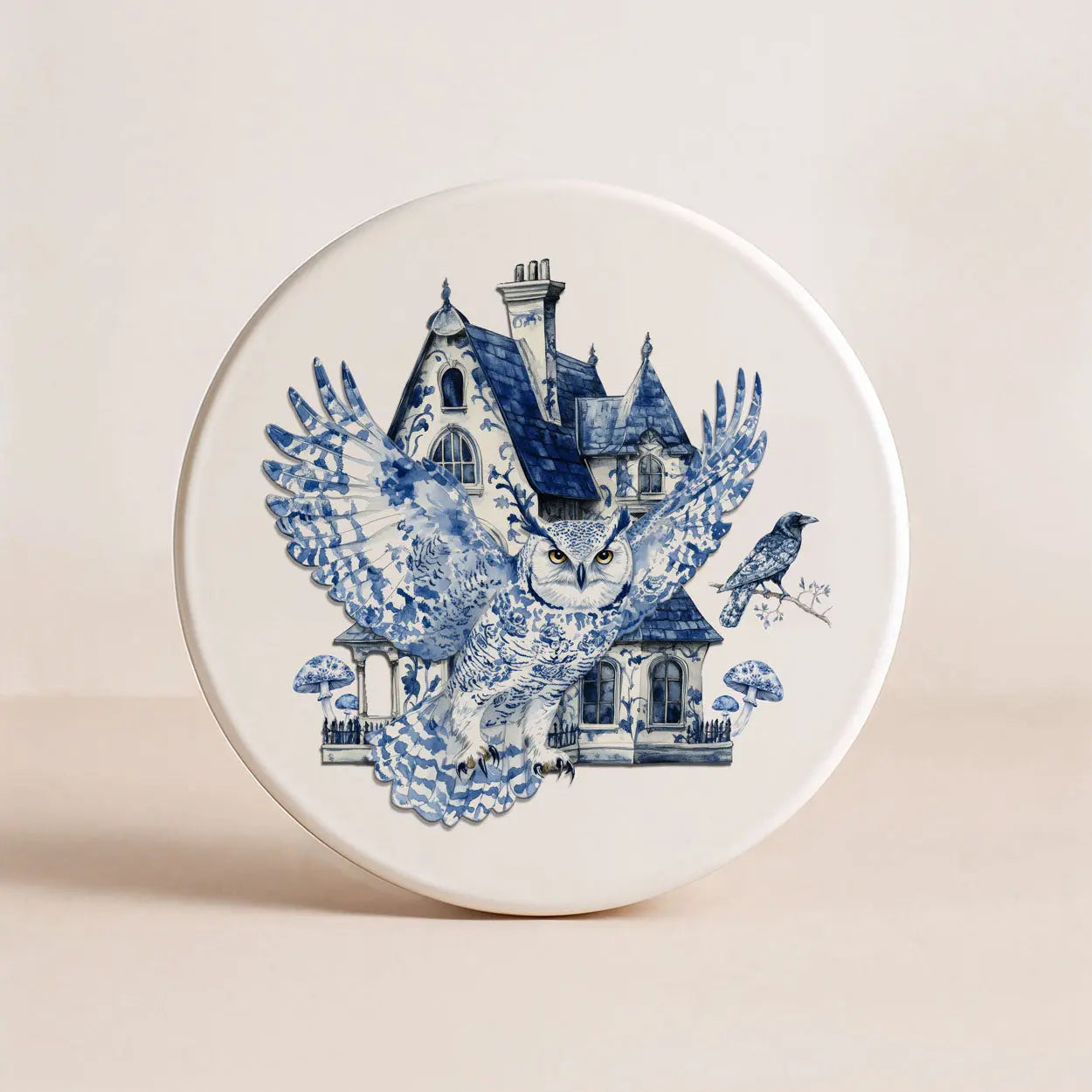 Decorative plate with blue owl and house design on a beige background