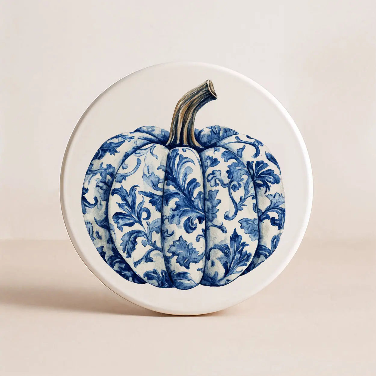 Decorative plate with a blue floral pattern on a white background