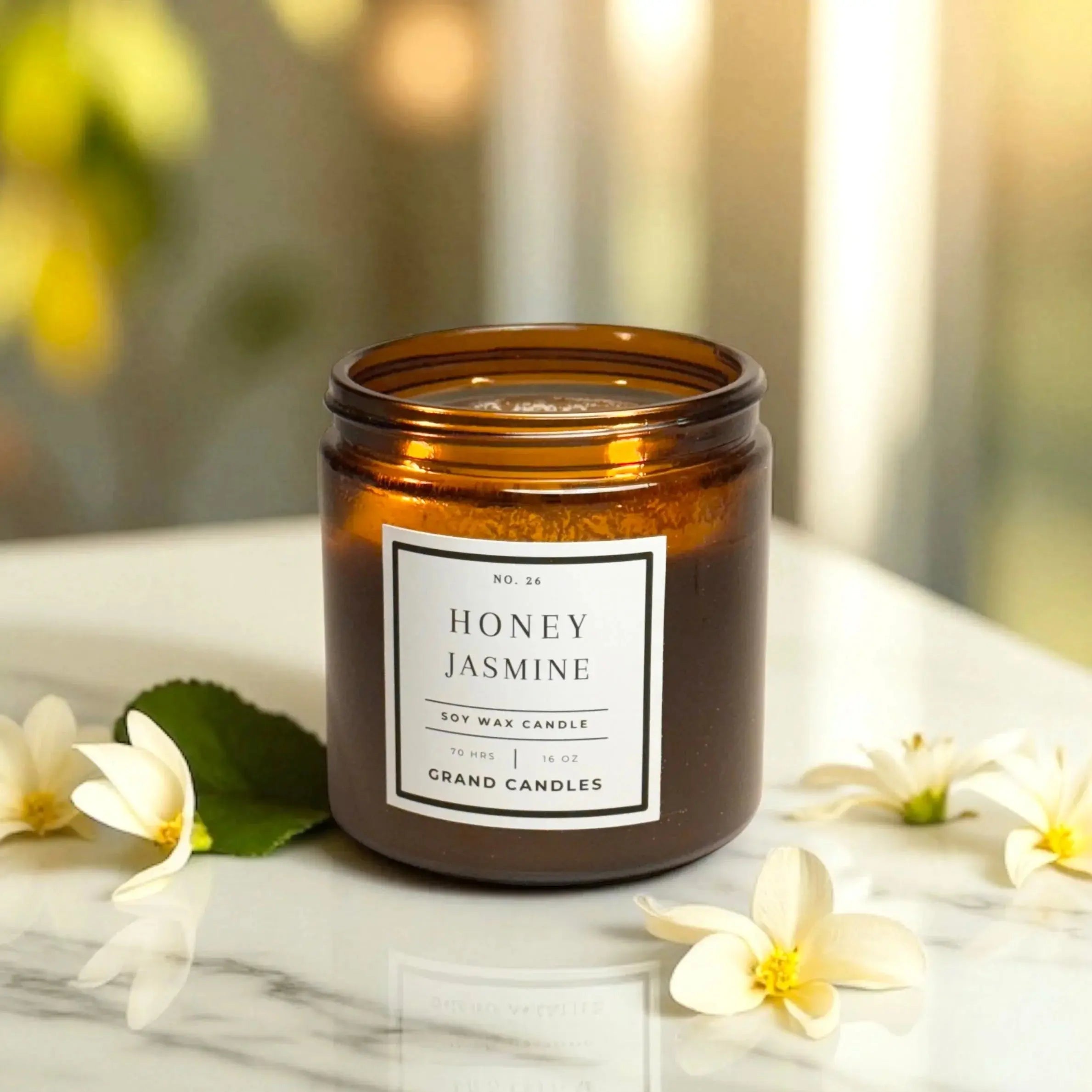 Honey Jasmine soy wax candle in amber jar with white flowers on marble, cozy home decor