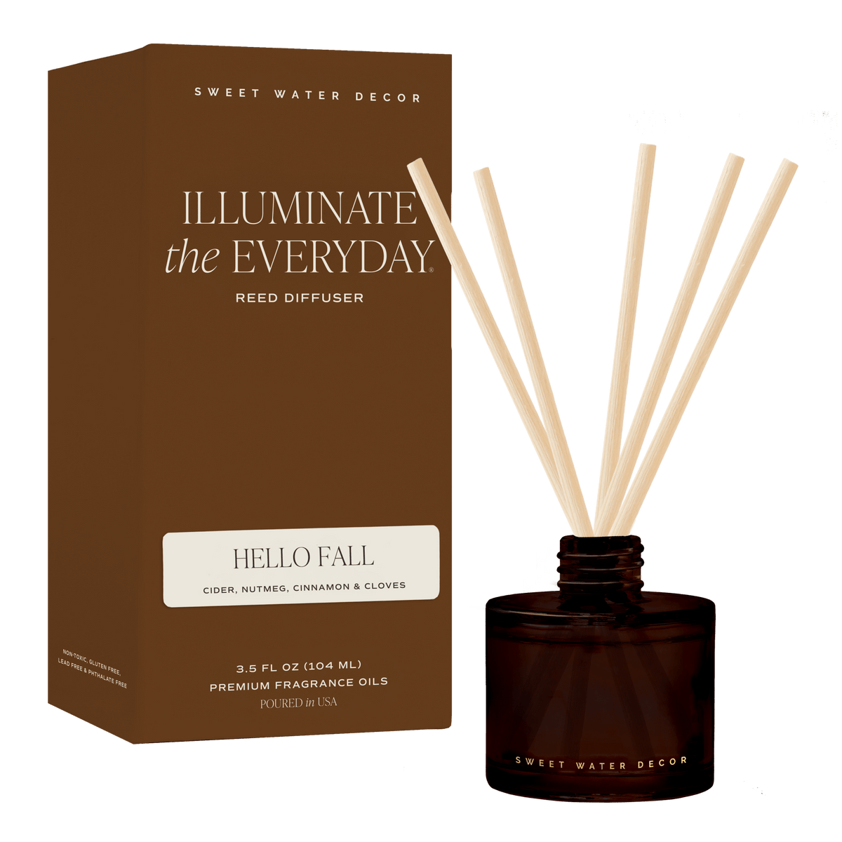 Sweet Water Decor 'Illuminate the Everyday' reed diffuser in 'Hello Fall' scent, showing the brown cardboard packaging box alongside the dark amber glass bottle with natural reed diffuser sticks, set against a solid green background.