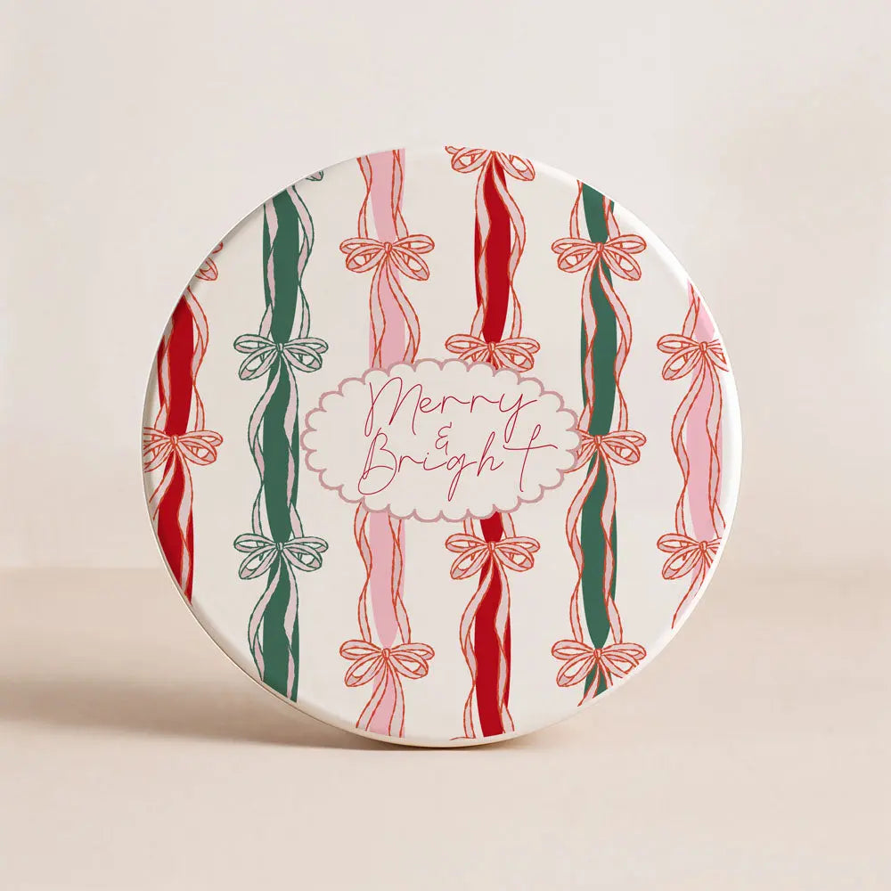 Decorative plate with candy cane and bow design on a beige background