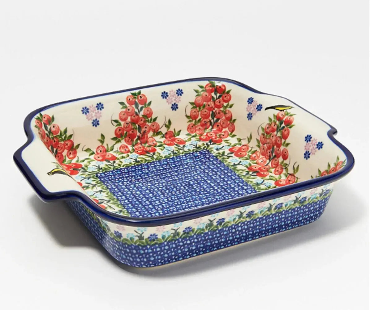 Floral ceramic baking dish with red berries, blue speckles, and farmhouse-style design for cozy kitchen decor