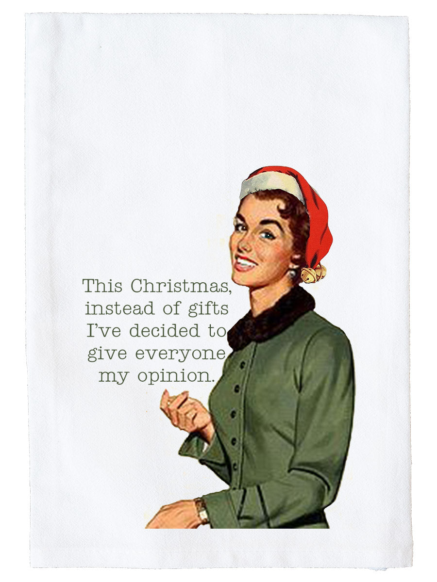 A white rectangular tea towel or fabric panel featuring a vintage-style illustration of a woman in a red Santa hat and green coat next to the printed text, 'This Christmas, instead of gifts I've decided to give everyone my opinion.'.