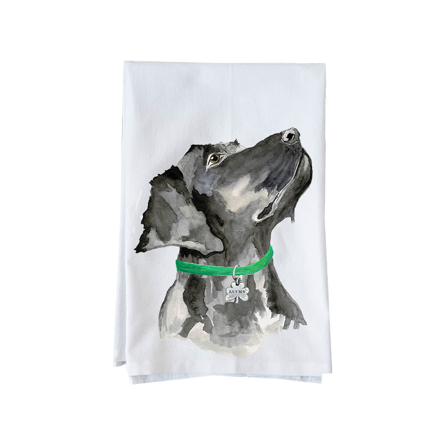 Tea towel with a black and white dog illustration and green collar on a white background