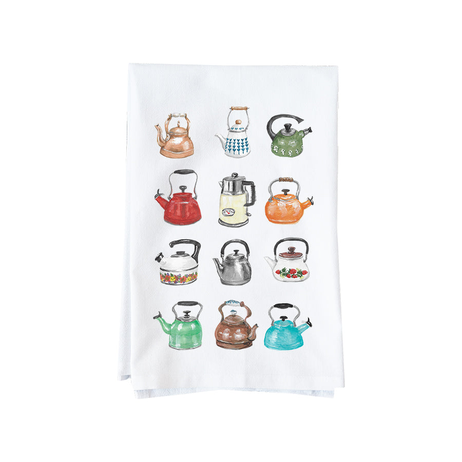 A white kitchen tea towel featuring a grid of twelve colorful watercolor-style illustrations of kettles in various colors and designs.