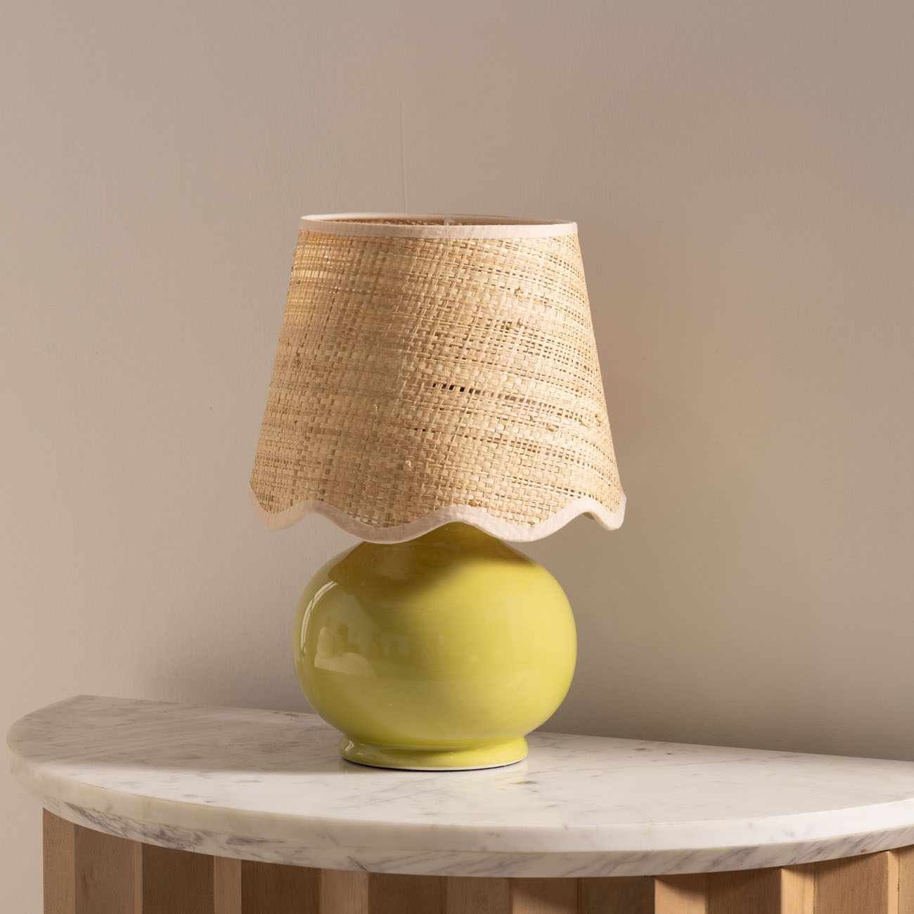 Theisseil olive green ceramic table lamp with beige cotton shade for farmhouse, traditional, and transitional home décor.