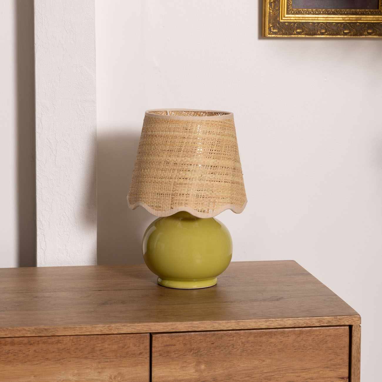 Theisseil olive green ceramic table lamp with beige cotton shade for farmhouse, traditional, and transitional home décor.