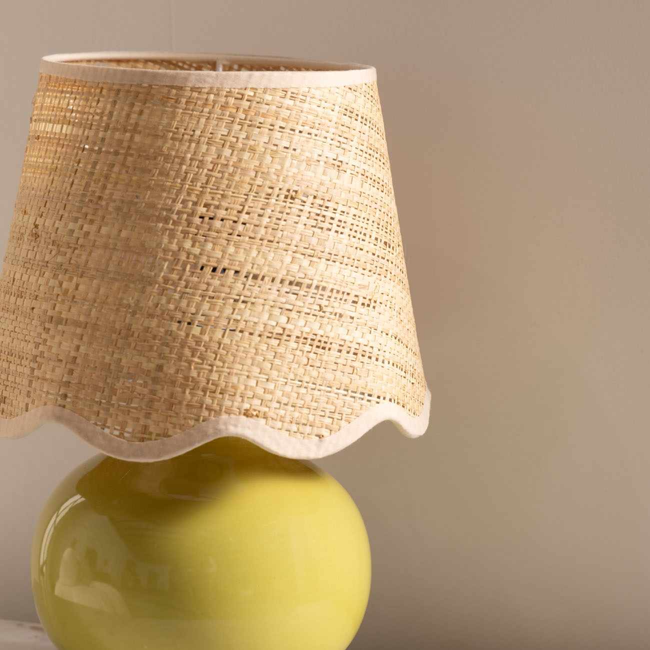Theisseil olive green ceramic table lamp with beige cotton shade for farmhouse, traditional, and transitional home décor.