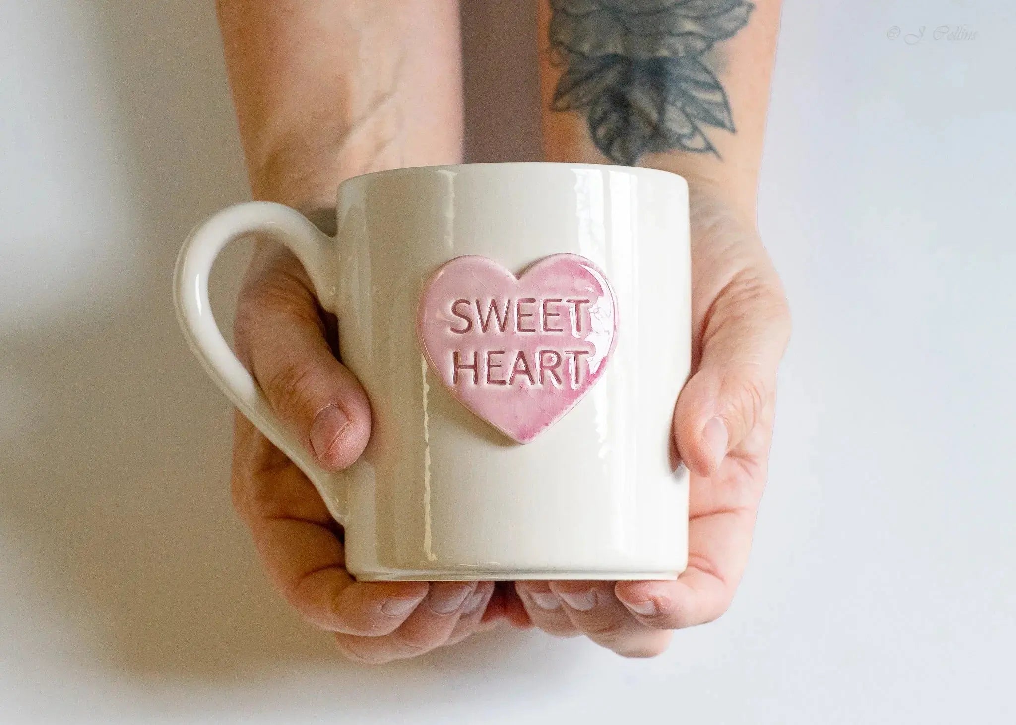 White ceramic mug with pink heart saying 'Sweet Heart', held in hands, cozy farmhouse decor