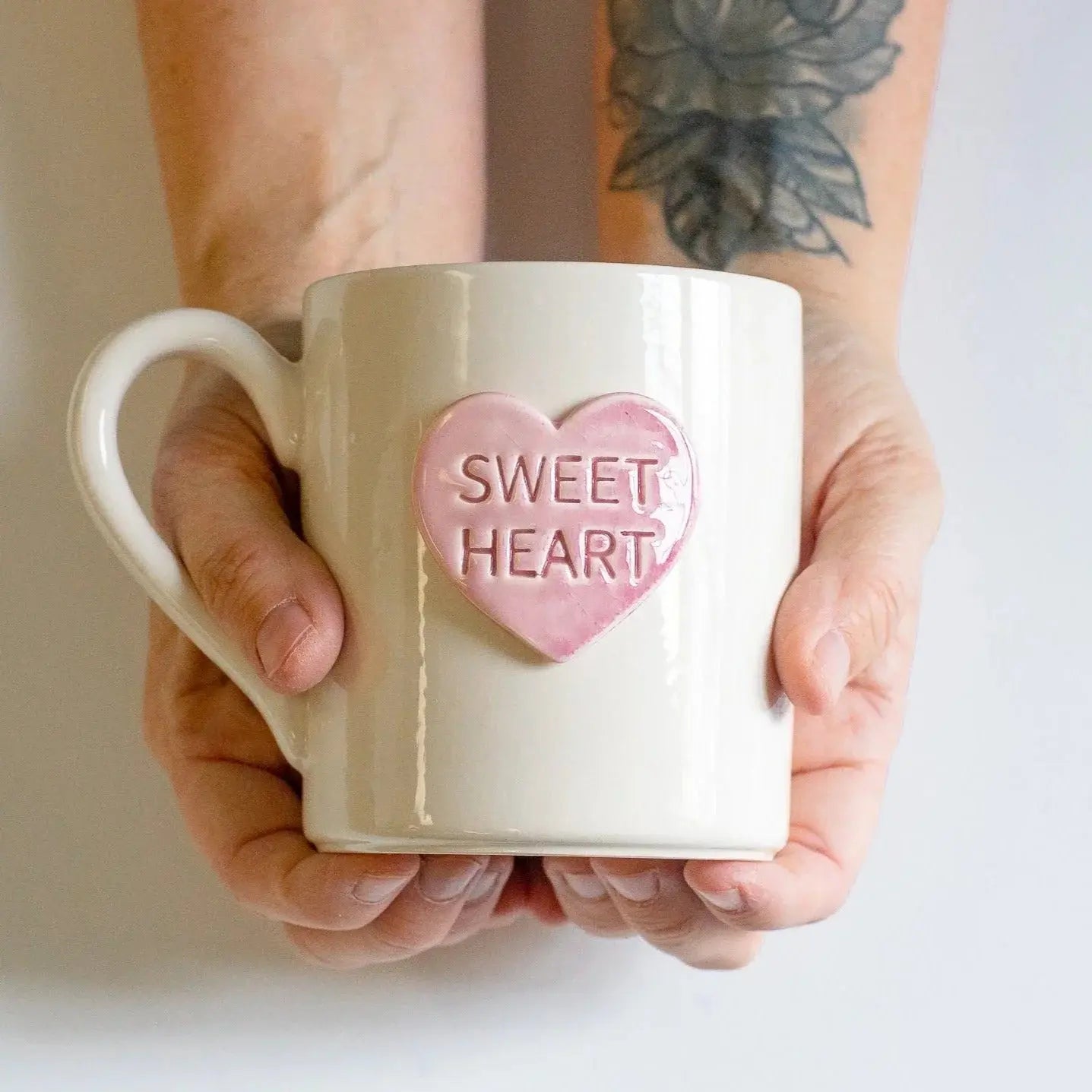 White ceramic mug with pink heart saying 'Sweet Heart', held in hands, cozy farmhouse decor