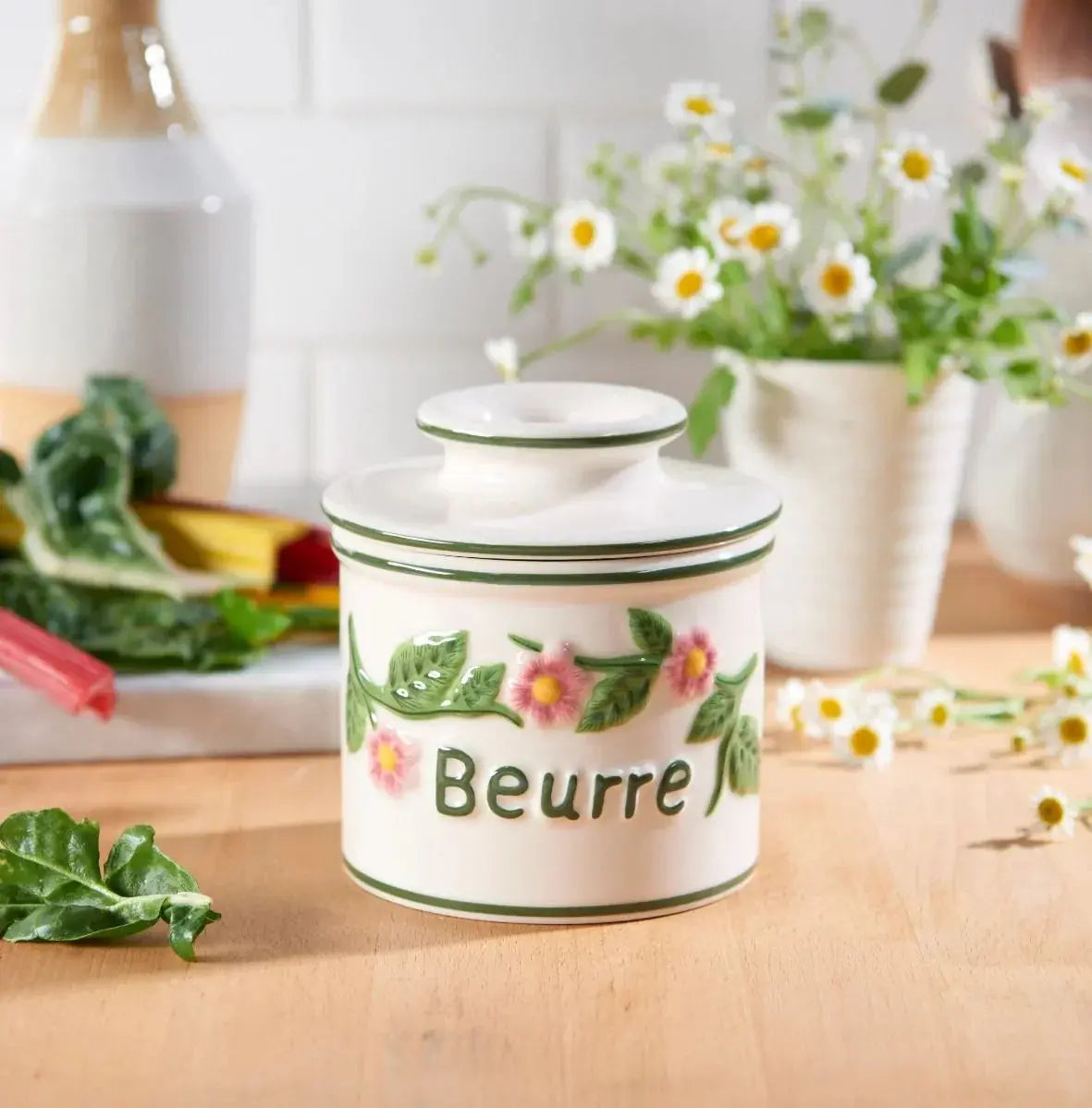 Ceramic butter crock with floral design and 'Beurre' label, perfect for farmhouse kitchen decor