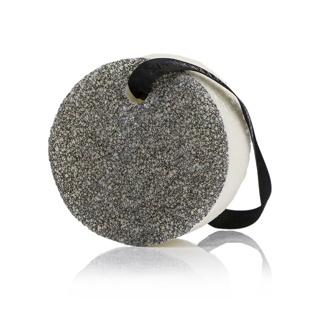 Round textured pouch with a strap on a white background