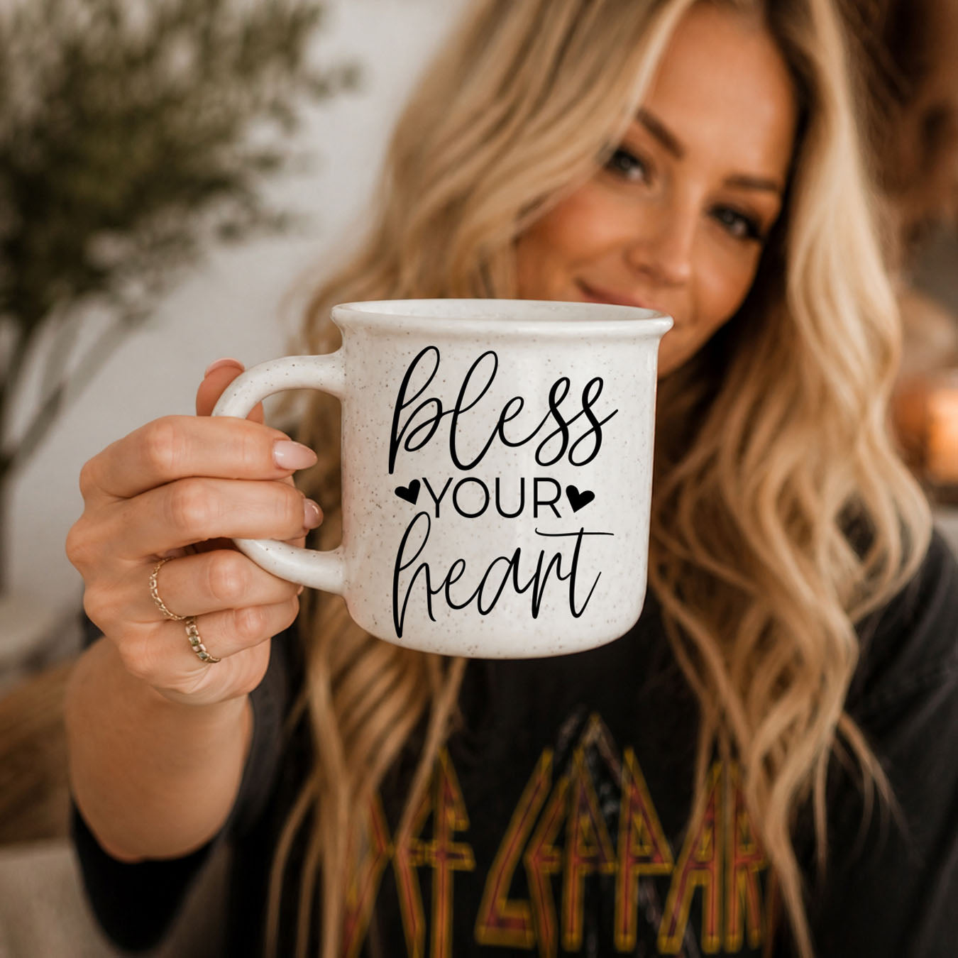 Woman holding a mug with 'bless your heart' text