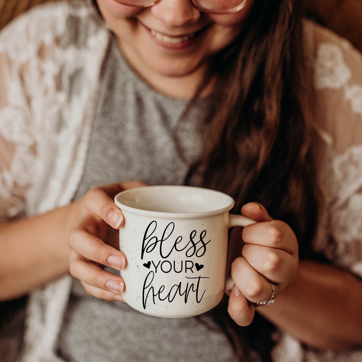Person holding a mug with 'bless your heart' text