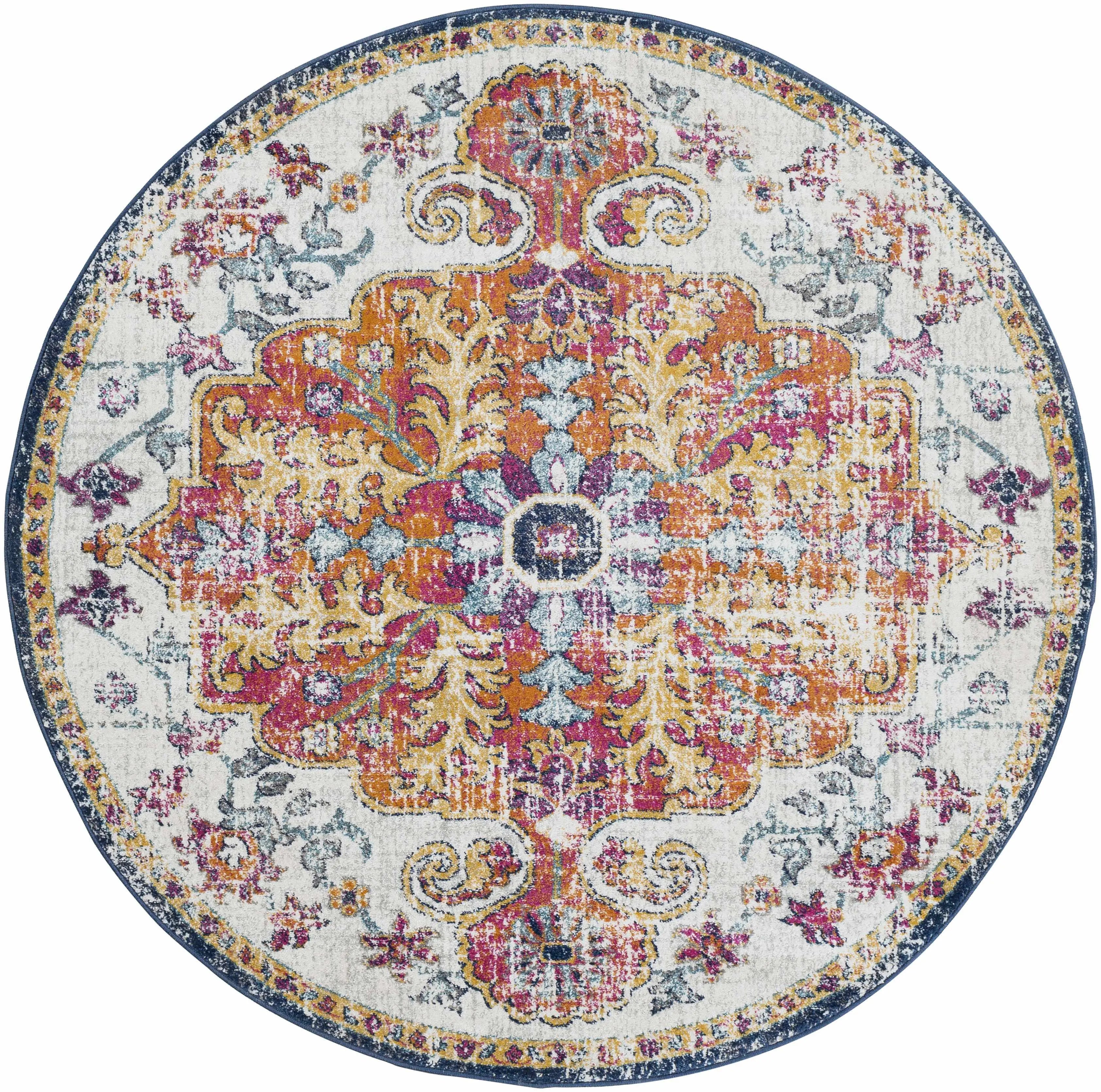 Round vintage-style area rug with floral medallion pattern in pink, gold, and blue for cozy farmhouse decor