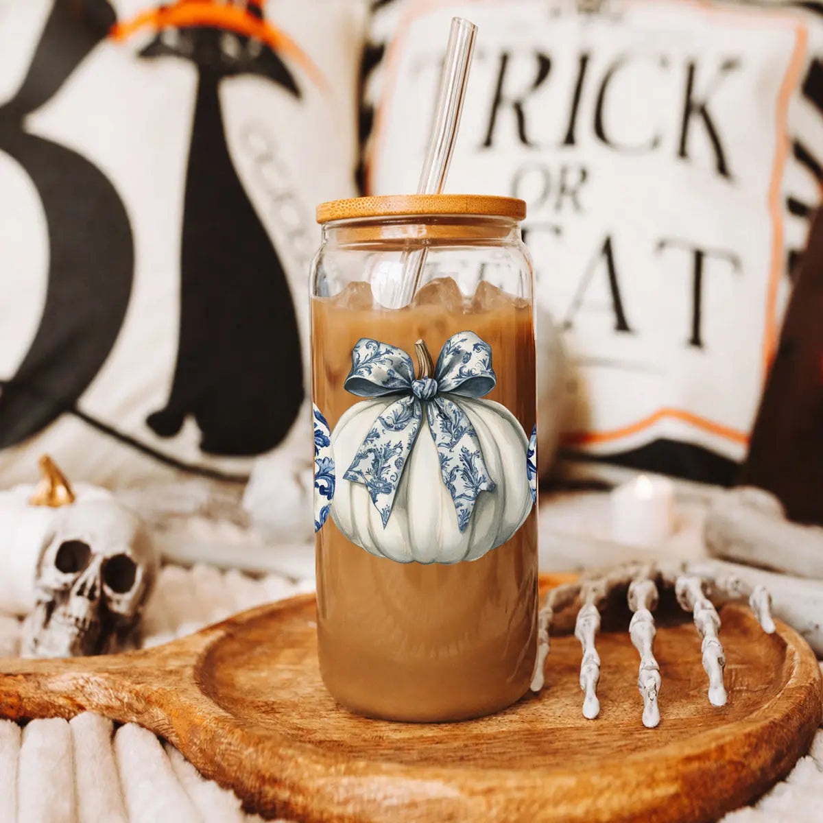 Mason jar with pumpkin design on a wooden board with Halloween-themed background