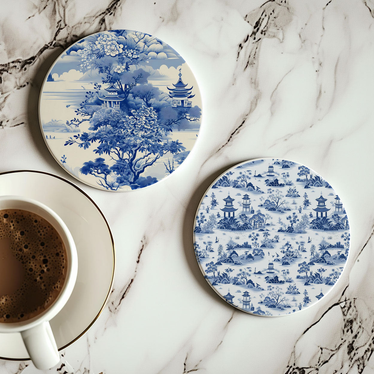 Two blue and white patterned coasters on a marble surface with a cup of coffee.