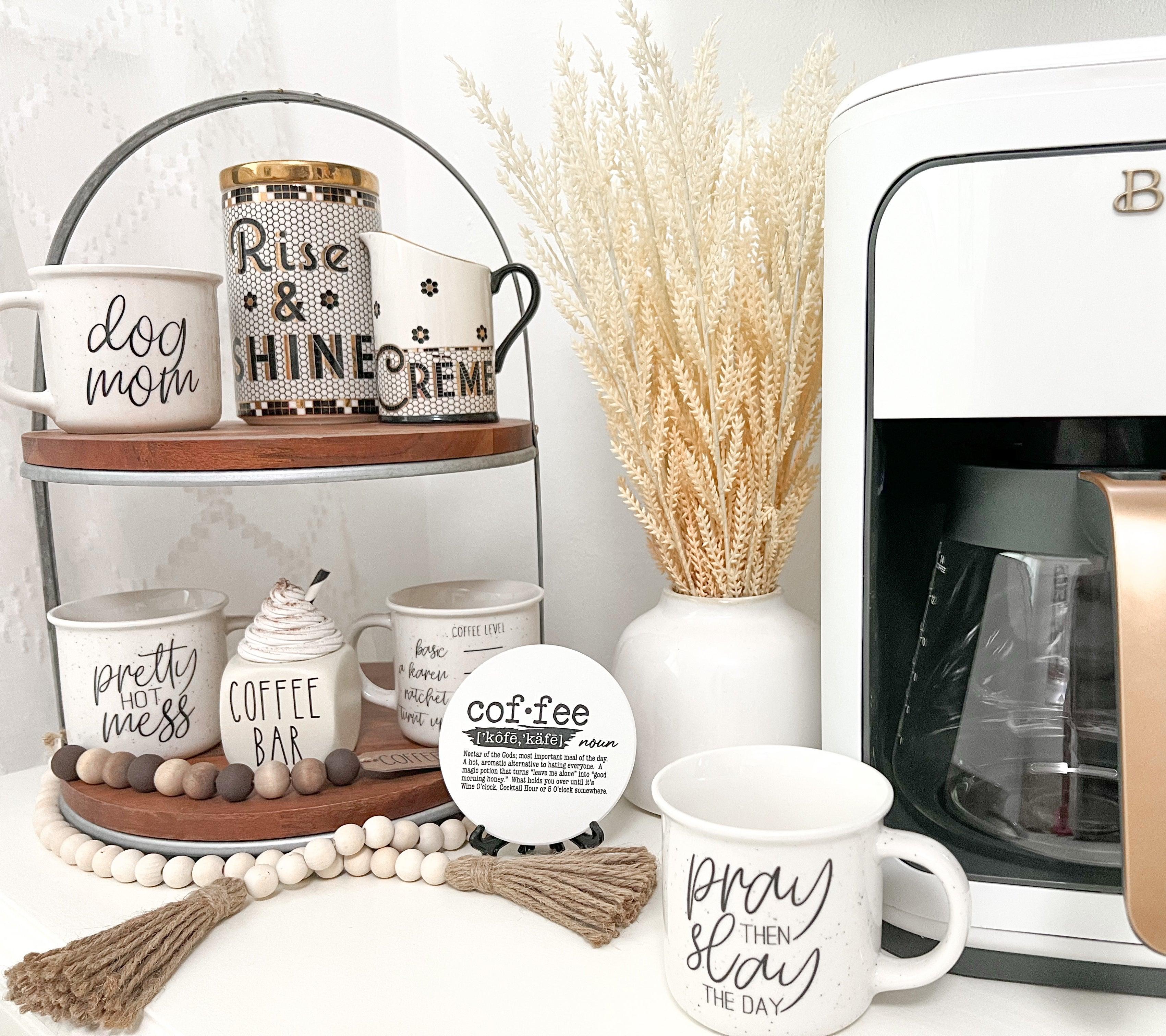 Coffee-themed decor items including mugs, a coffee bar sign, and a coffee machine.