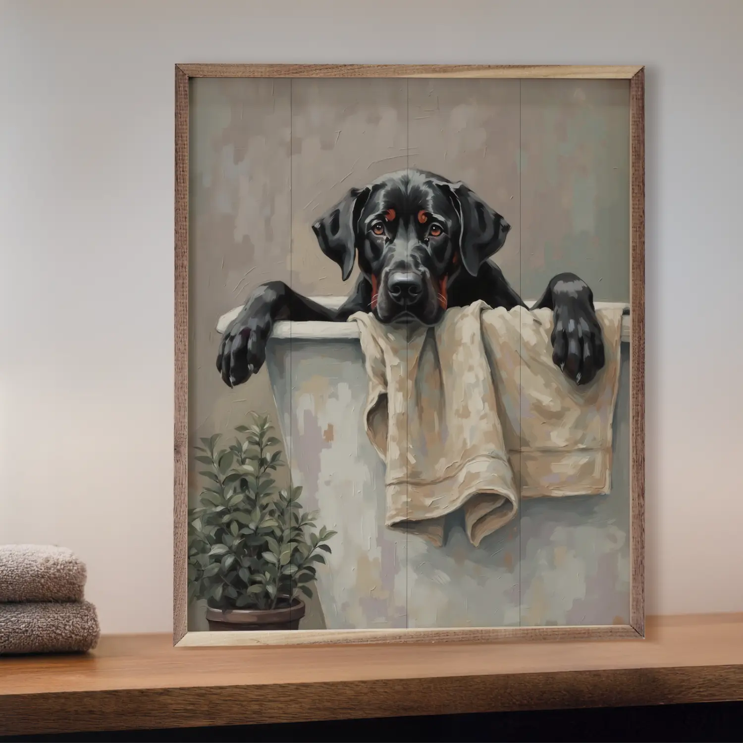 Framed artwork of a black dog with a towel on a shelf.
