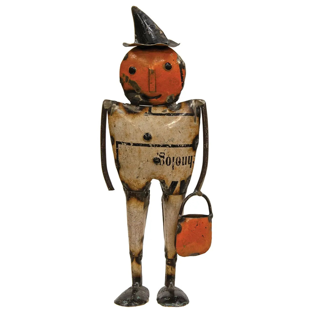 Vintage metal Halloween pumpkin doll with a weathered orange face and hat, a rusted beige body, and black legs, holding an orange bucket against a white background.