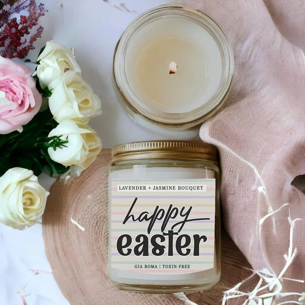 Candle jar labeled 'Happy Easter' with flowers on a soft pink background